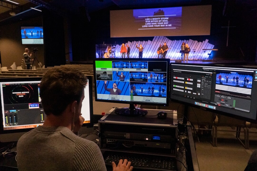 Production team collaborating around a broadcast switcher desk
