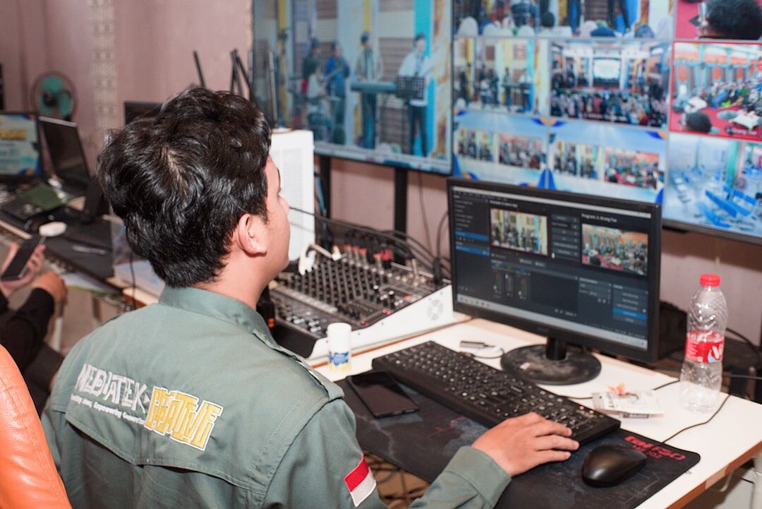 Broadcast control room with multiple camera feed monitors