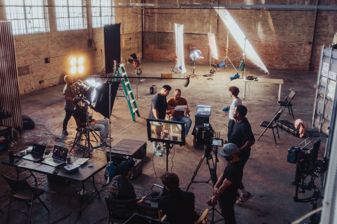 Wide view of a live television studio set with lighting rigs